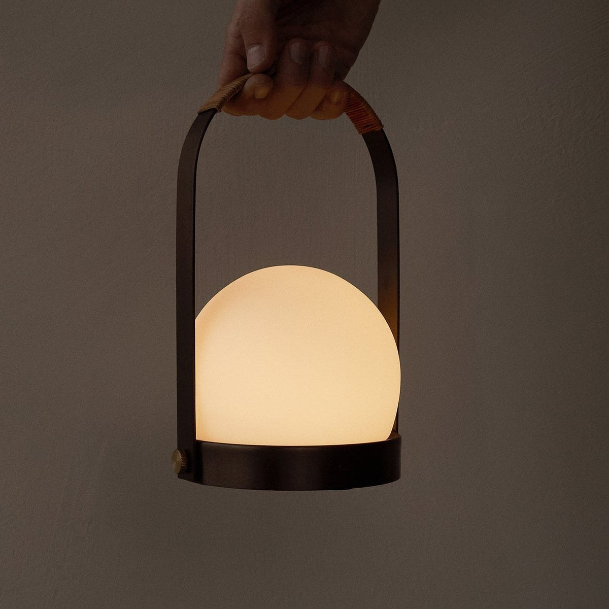 Audo Copenhagen Carrie LED Lamp Bronzed Brass carried by the handle - KANSO#Color_Bronzed Brass