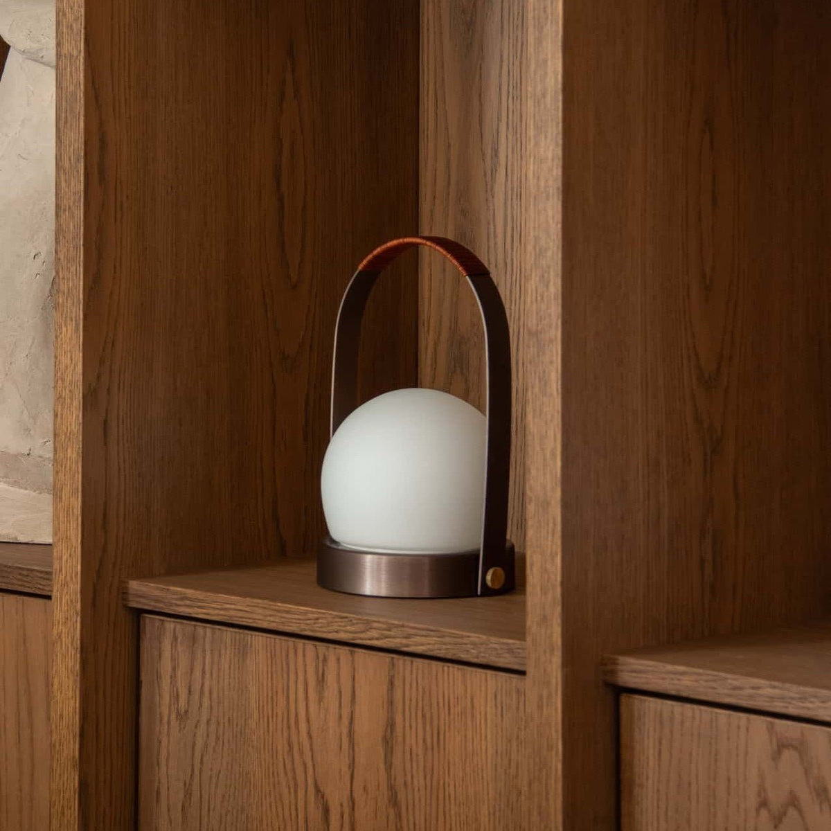 Audo Copenhagen Carrie LED Lamp Bronzed Brass on a shelf - KANSO#Color_Bronzed Brass