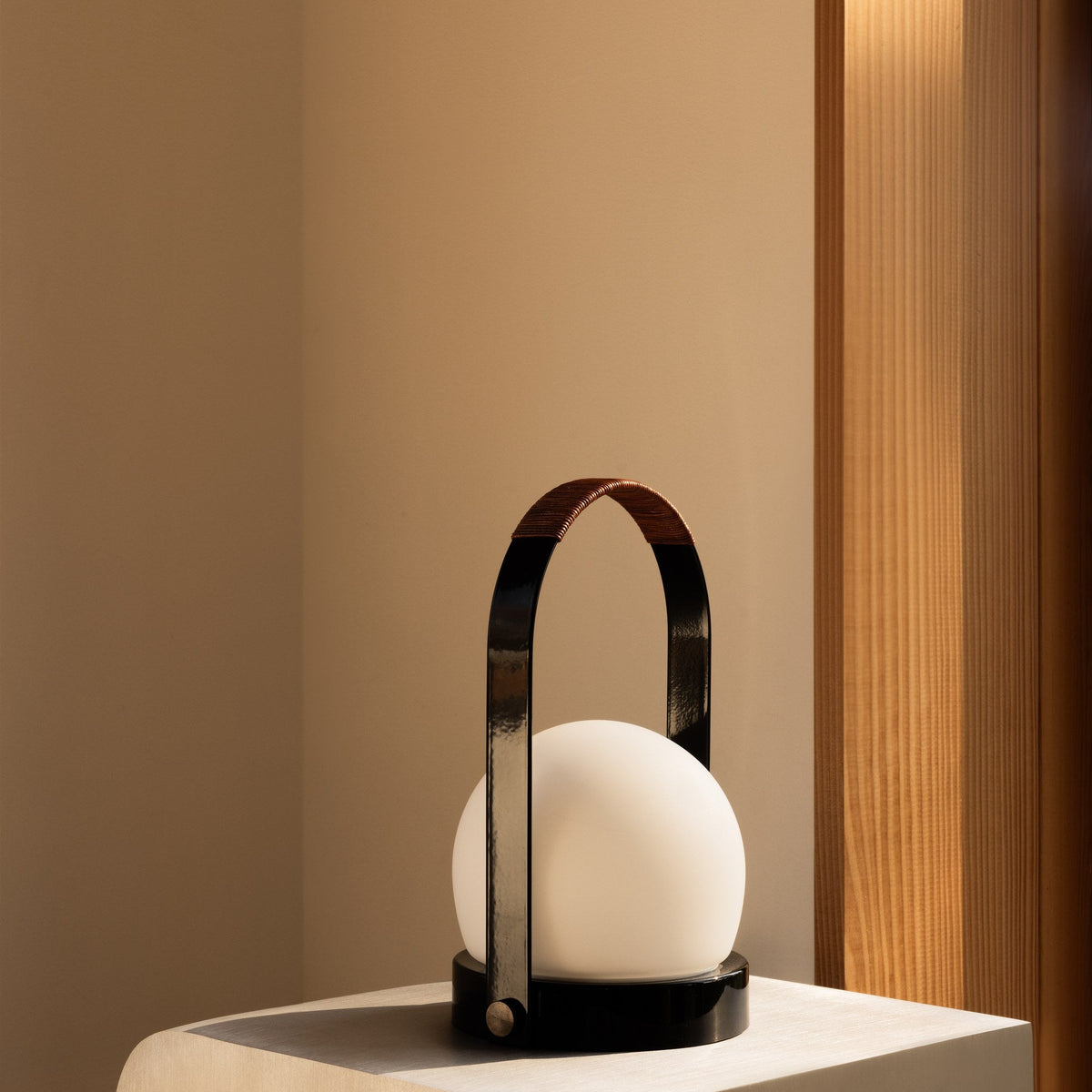 Audo Copenhagen Carrie LED Lamp Black Leather on a plinth - KANSO#Color_Black Leather