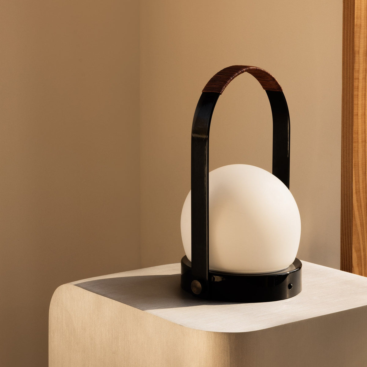 Audo Copenhagen Carrie LED Lamp Black Leather in a corner - KANSO#Color_Black Leather