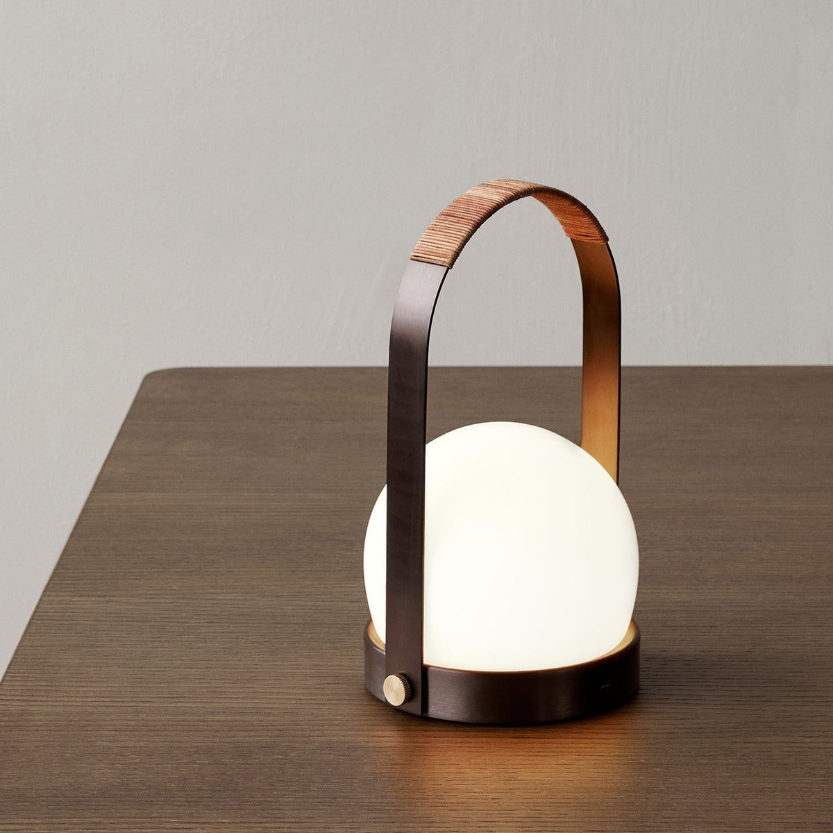 Audo Copenhagen Carrie LED Lamp Bronzed Brass on a table - KANSO#Color_Bronzed Brass